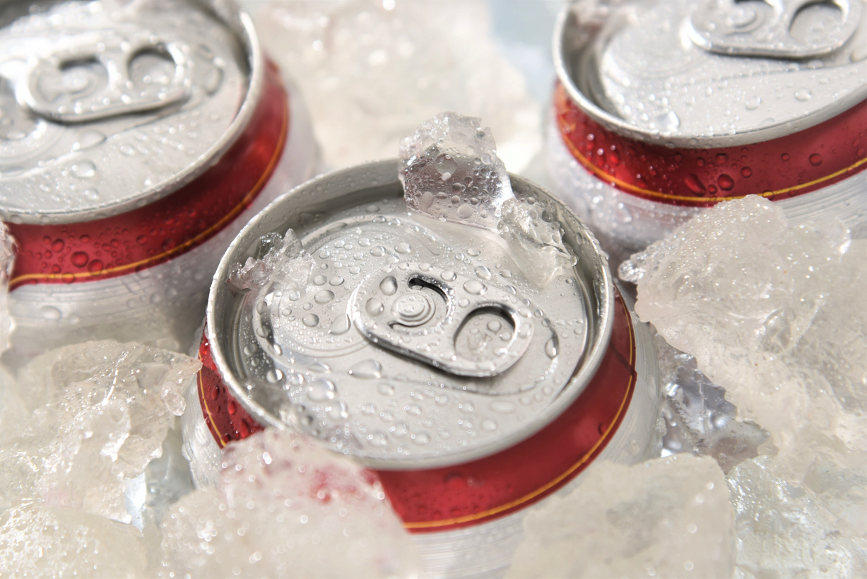 beach cooler with canned drinks and ice