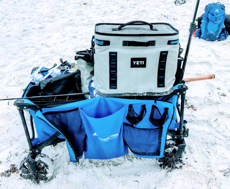 Yeti beach cooler sitting on beach wagon