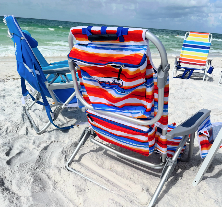 3 folding beach chairs at the ocean